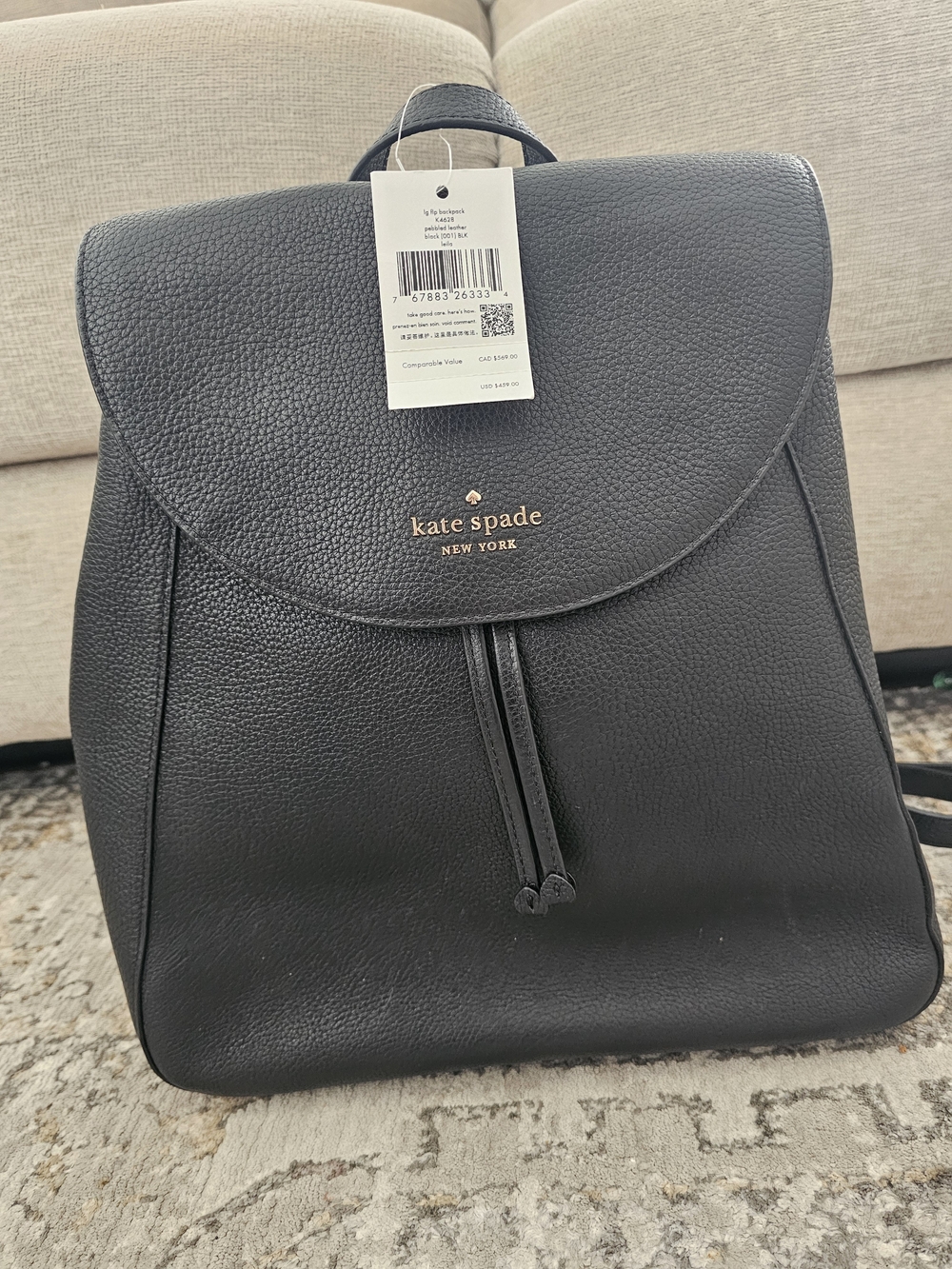 kate spade Black Pebbled Leather Backpack with Gold Logo